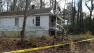 Authorities say a woman was attacked near this vacant home.