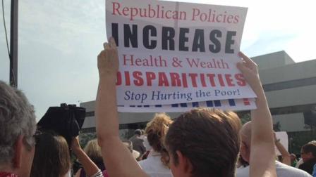 A protestor holds up a sign at a recent demonstration in Raleigh.