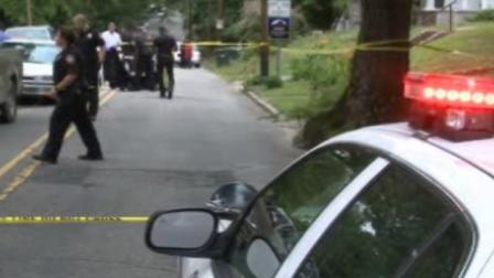 Police investigate on North Hyde Park Avenue just past East Main Street.