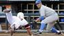 UCLA pitcher Nick Vander Tuig right, prepares to tag out North Carolina States Jake Armstrong at home plate on a single by Trea Turner in the third inning of an NCAA College World Series baseball game in Omaha, Neb., Tuesday, June 18, 2013.