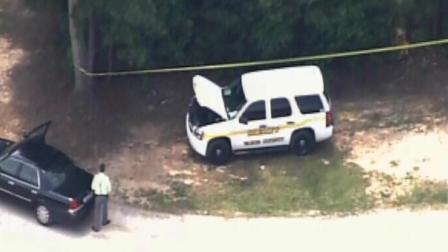 Authorities investigate at a Kerr Lake boat ramp.