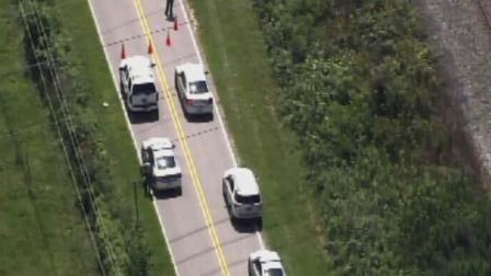 Officers investigate a fatal motorcycle accident.