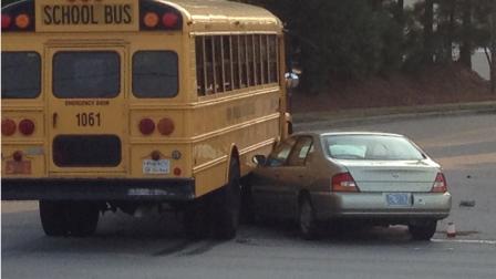 A car ended up wedged under the side of the school bus in this crash Tuesday morning.
