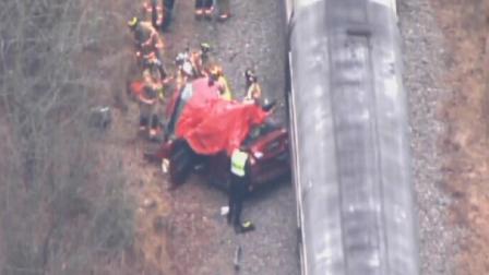 Emergency workers at the scene of an accident involving an Amtrak train and a car in Cary.