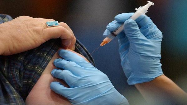 Photo of a person receiving a shot