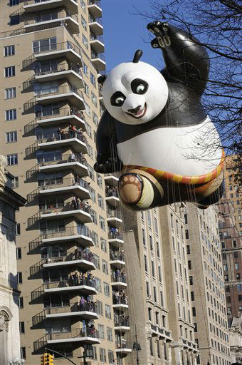 The Kung Fu Panda balloon passes an apartment...