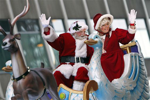 Santa Claus and Mrs. Claus wave to spectators during the 93rd annual Thanksgiving day parade, Thursday Nov. 22, 2012, in Philadelphia.