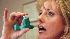 Woman using inhaler