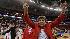 Coach Kay Yow displays wolfpack symbol.