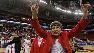 Coach Kay Yow displays wolfpack symbol.