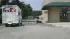 A bear runs across a parking lot in Durham