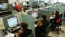 People working on computers in office