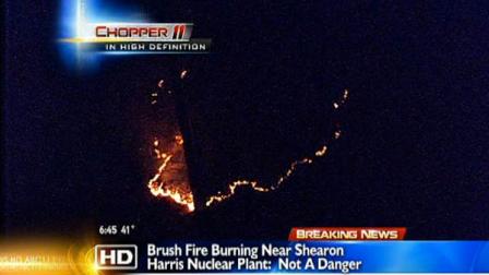 A fire broke out in a wooded area dangerously close to the Shearon Harris nuclear power plant early Friday morning.