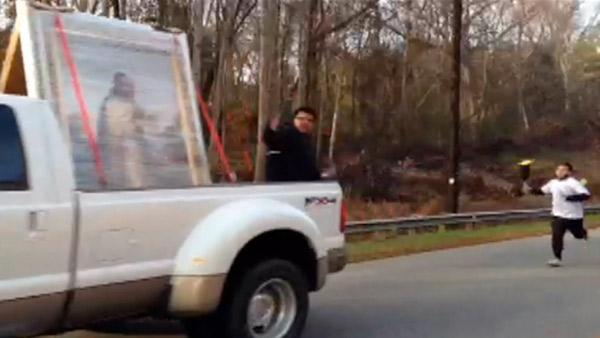 Photo of a runner with the Guadalupe torch on Hwy 98 in Wake County on Nov. 30, 2012