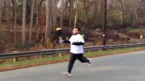 Photo of a runner with the Guadalupe torch on Hwy 98 in Wake County on Nov. 30, 2012