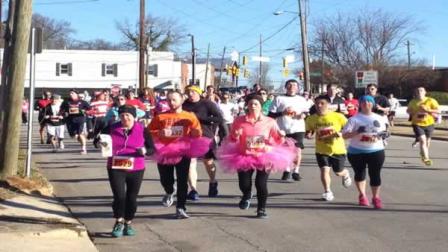 Participants ran 2.5 miles to the downtown Raleigh Krispy Kreme store Saturday, ate a dozen doughnuts, and ran 2.5 miles back to the N.C. State Belltower in under an hour.