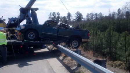 Crews hoisted the Ford Explorer out of the embankment on US-64