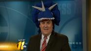 Don Big Weather Schwenneker shows off dinosaur hat from Museum of Life and Science in Durham