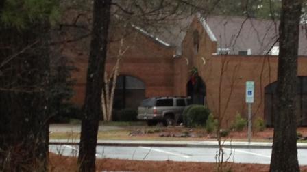 When firefighters arrived at St. Luke the Evangelist Catholic Church, they found an SUV that had crashed into the front of the church as well as a fire in the building.