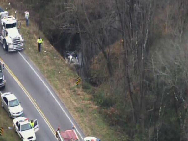 Emergency workers pulled an upside down car out...