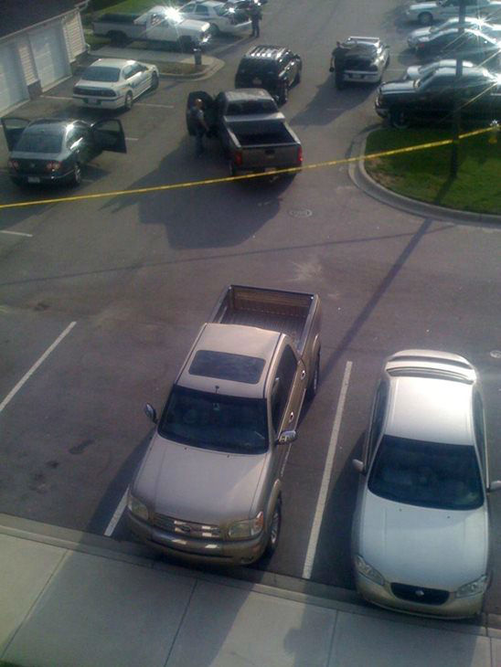 Crime tape up in front of a building at the...