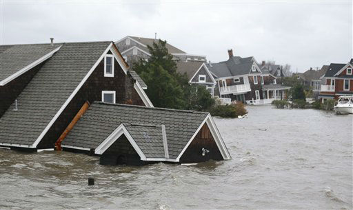 Floodwaters surround homes near the Mantoloking...