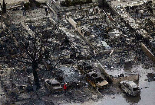 This aerial photo shows burned-out homes in the...