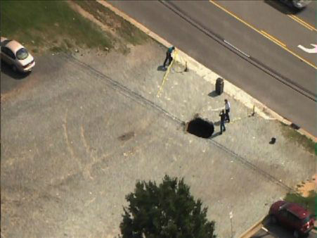 A sinkhole formed Tuesday afternoon near the...