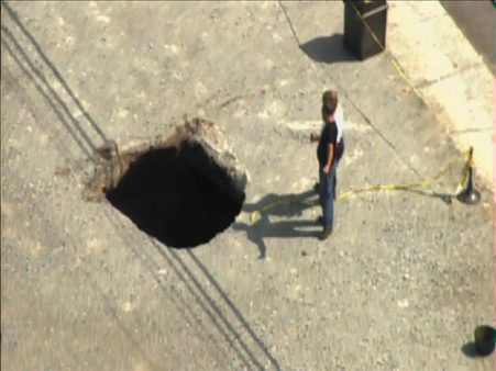 A sinkhole formed Tuesday afternoon near the...