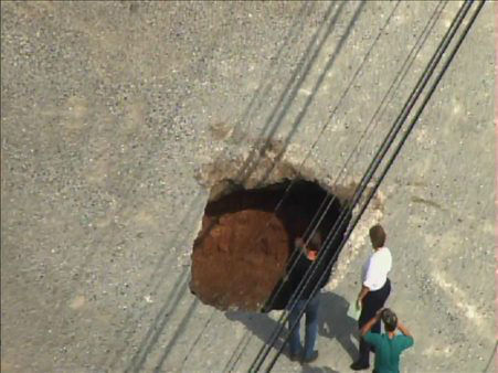 A sinkhole formed Tuesday afternoon near the...