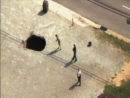A sinkhole formed Tuesday afternoon near the...