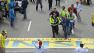 Medical workers wheel the injured across the finish line during the 2013 Boston Marathon following an explosion in Boston, Monday, April 15, 2013. Two explosions shattered the euphoria of the Boston Marathon finish line on Monday.