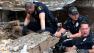 Moore police dig through the rubble of the Plaza Towers Elementary School following a tornado in Moore, Okla., Monday, May 20, 2013.