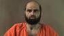 FILE - This undated file photo provided by the Bell County Sheriffs Department shows Nidal Hasan, the Army psychiatrist charged in the deadly 2009 Fort Hood shooting rampage that left 13 dead.