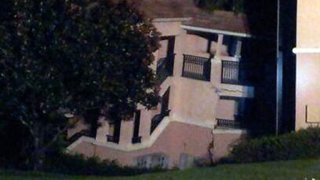 A building at the Summer Bay Resort in Clermont, Fla, shows damage from collapsing into a sinkhole early Monday Aug. 12, 2013.