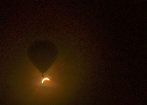 Starting just after dawn, the eclipse cast its...