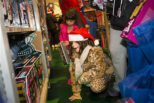 Savannah Finnerty, 7, of Queens, looks on...