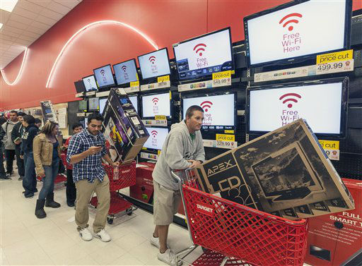 Shoppers use their smart phone with the Free...