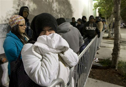 Nelly Vasquez and several thousand people wait...