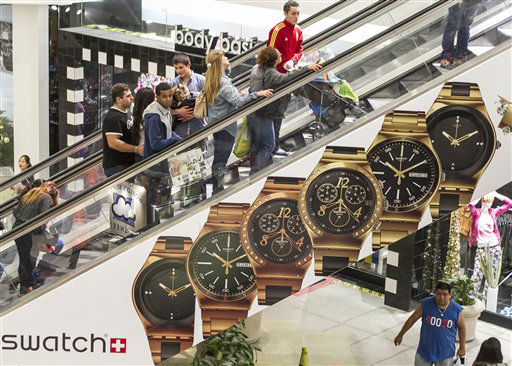 Consumers shop early morning hours Friday, Nov....