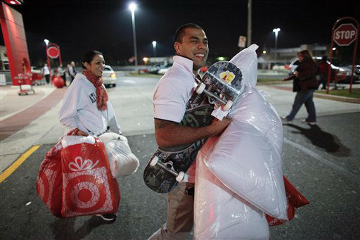 Rafael Pinguim, right, and Johanna Santos carry...