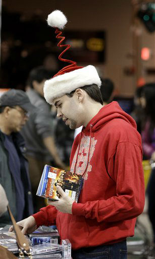 Clint Fletcher shops for movies at a Best Buy...