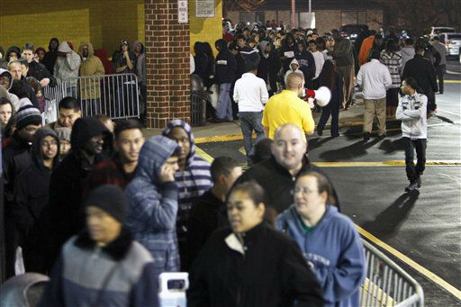 People wait in line, on Thursday Nov 22, 2012,...