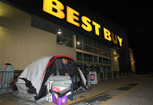Stefan Rood, 20, folds blankets as he cleans out...