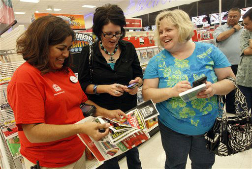 Target team member Melba Breidenstein assists...