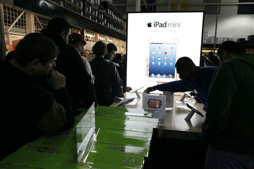 Customers shop for Black Friday discounts at a...