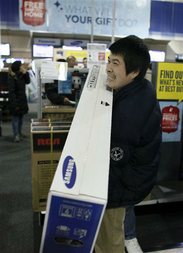 Customers shop for Black Friday discounts at a...