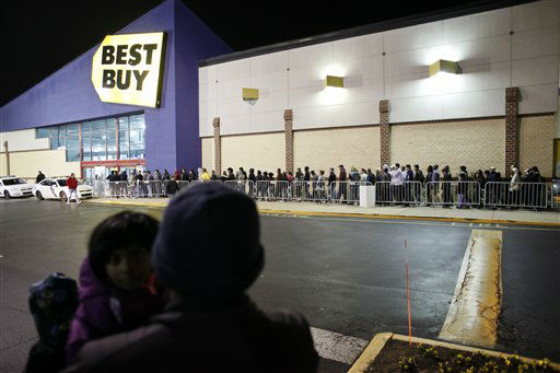 People wait in line, on Thursday Nov 22, 2012,...
