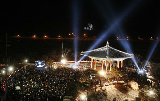 People gather to celebrate the New Year at...