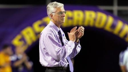Terry Holland watches an East Carolina football game at Dowdy-Ficklen stadium in Greenville, N.C.